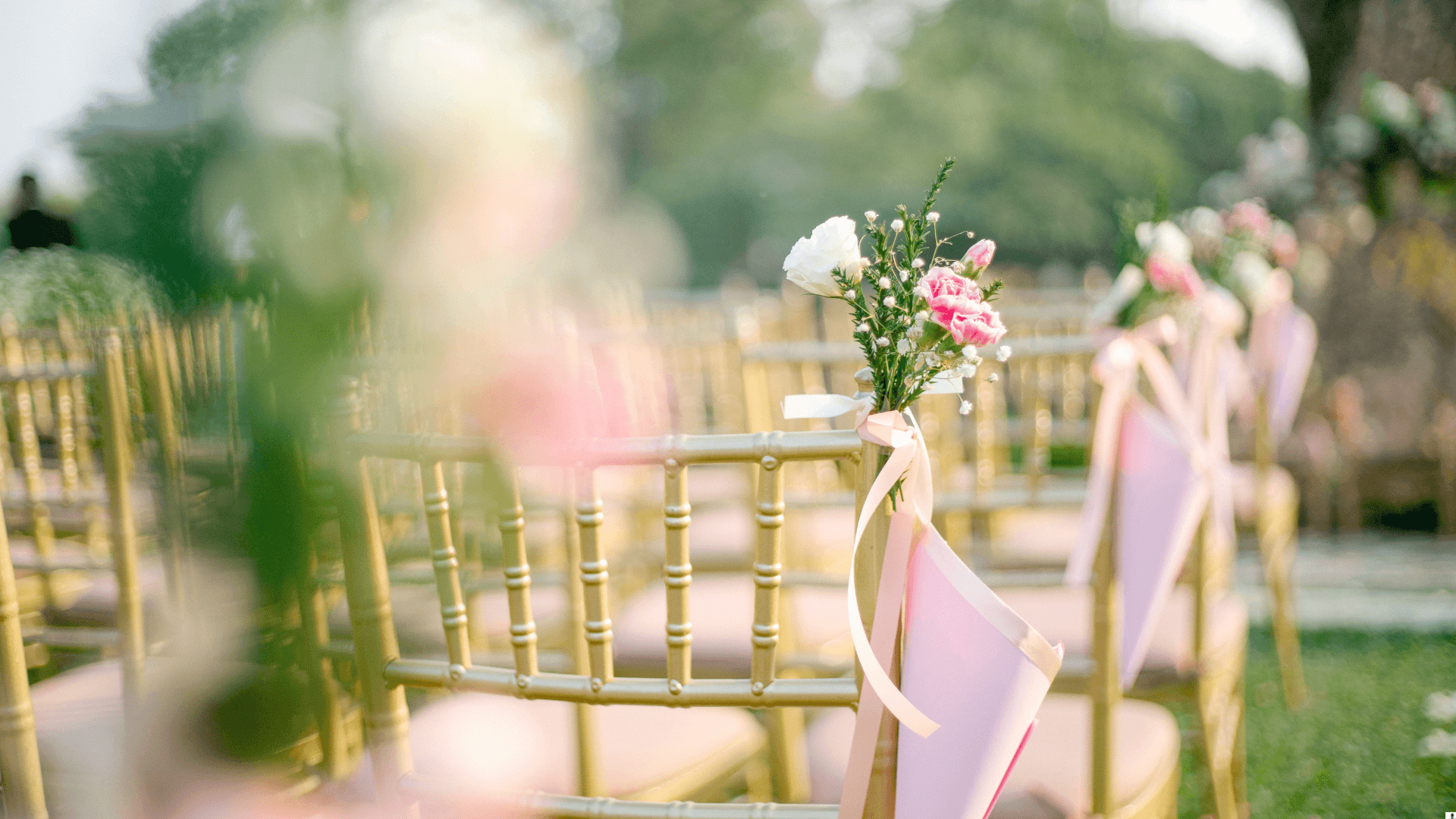 Gold Chiavari chairs at outdoor ceremony