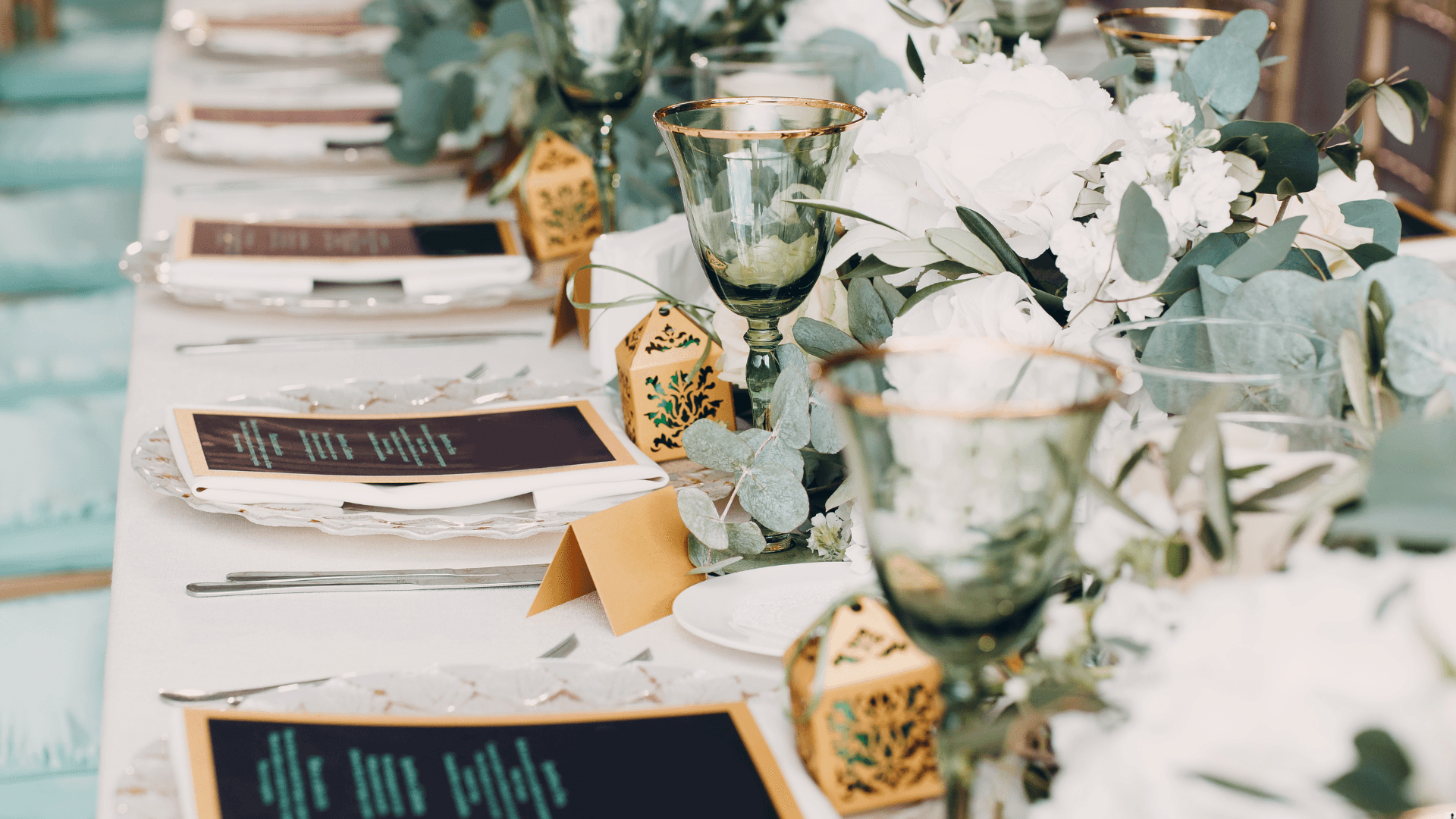 Long dining table with green and gold accents
