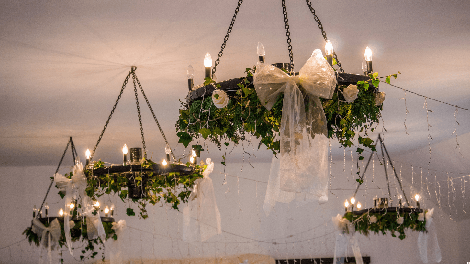 Decorative chandeliers with floral arrangements
