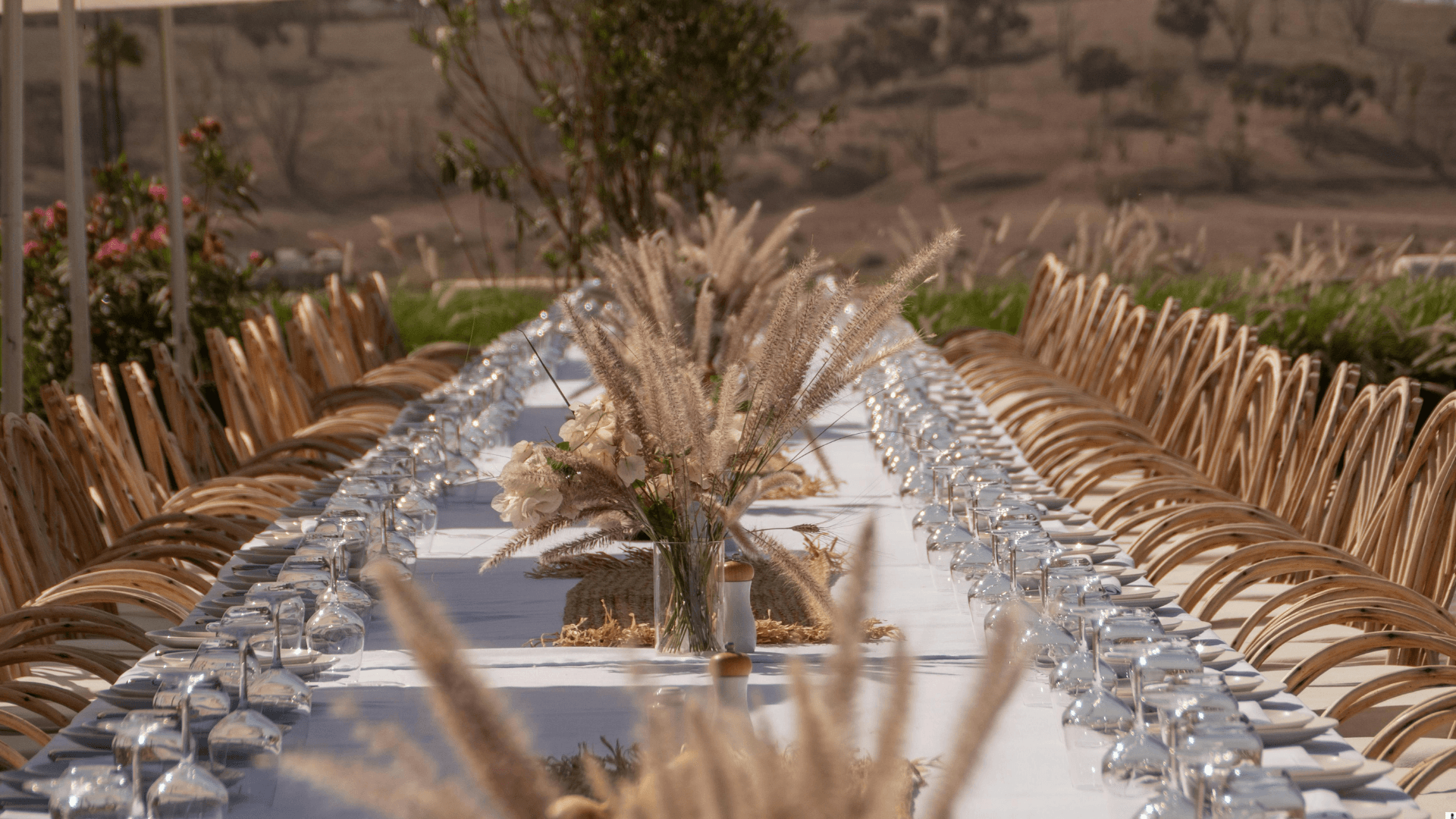 Boho outdoor long table with pampas grass