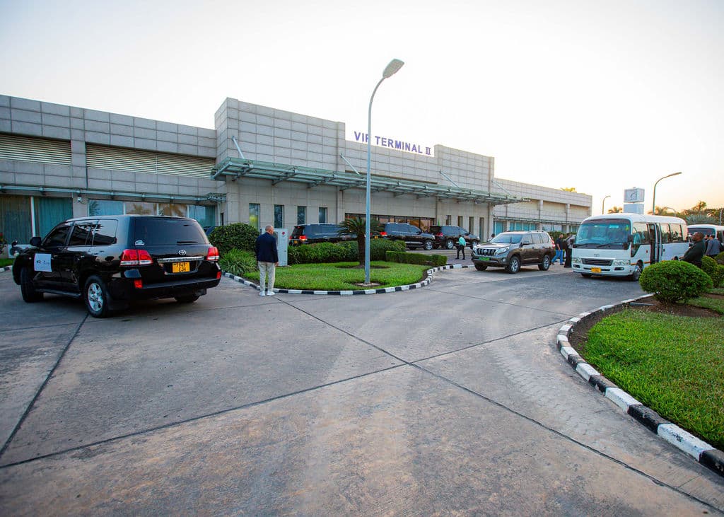 Motorcade of vehicles gathered outside the VIP Terminal II building