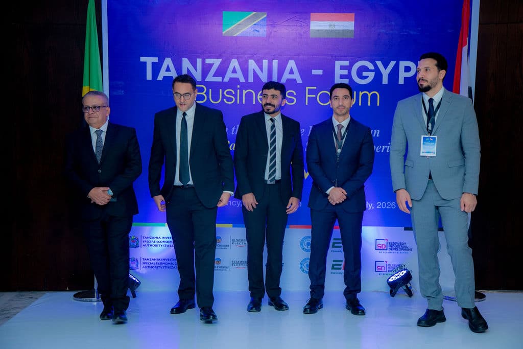 Five executives posed on stage in front of the Tanzania-Egypt Business Forum backdrop